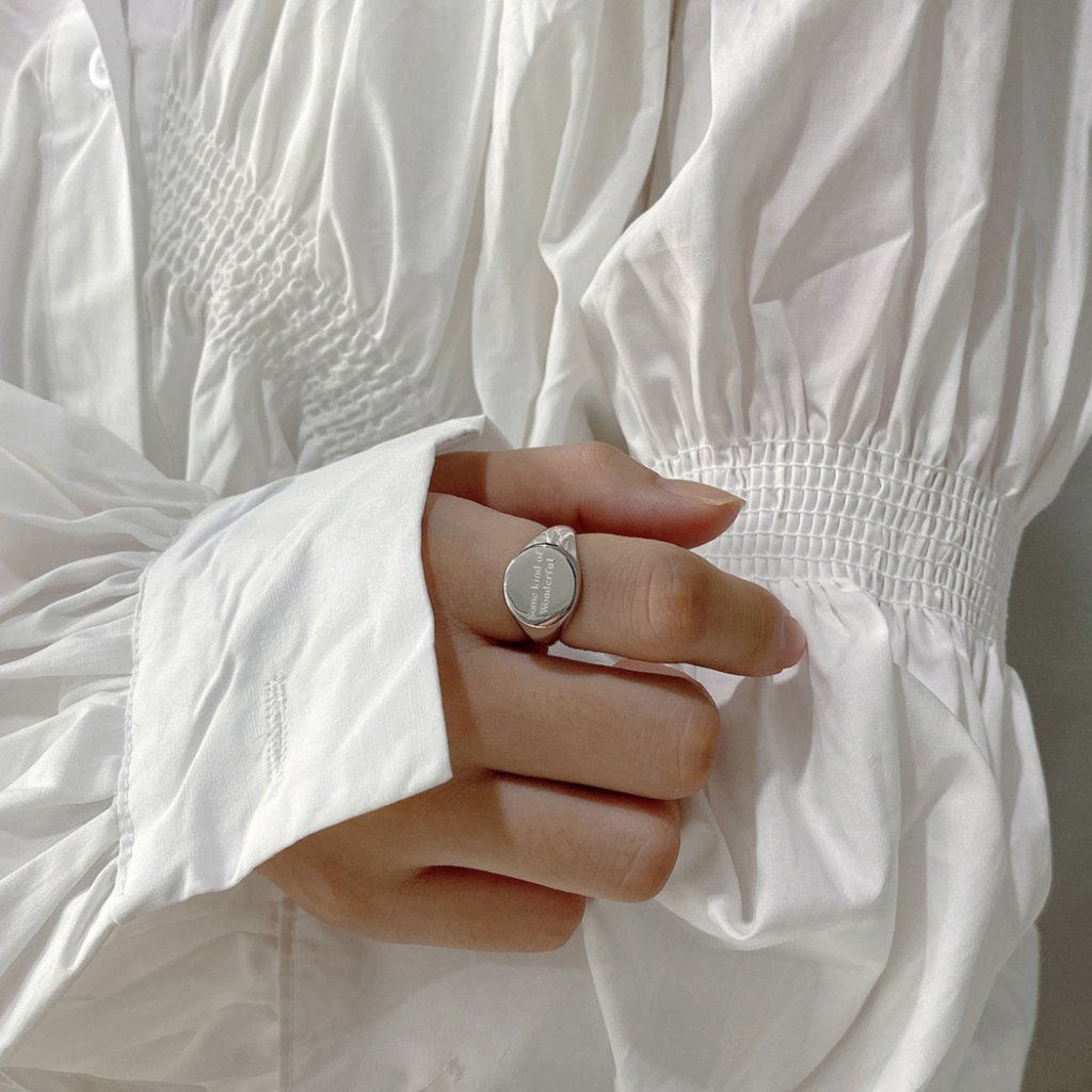 Classic silver signet ring for women photographed for a marketplace listing